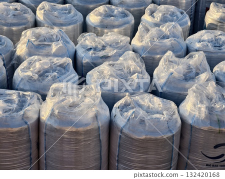 warehouse storing charcoal briquettes efficiently, industrial warehouse filled with prepared warehouse storing charcoal briquettes efficiently, industrial warehouse filled with prepared 132420168