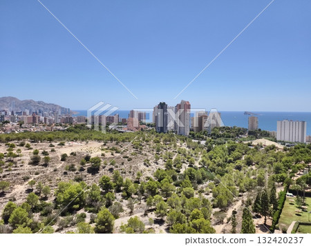 coastal park scenic, panoramic view of coastal park, bright midday scene of coastal park with towers 132420237