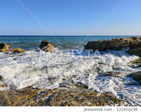 foam moves silently, foam drifts over rocky surface, retreating foam forms swirling patterns foam moves silently, foam drifts over rocky surface, retreating foam forms swirling patterns 132420286