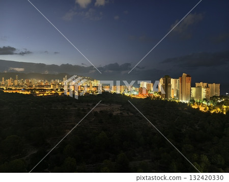 night view imagery, peaceful twilight cityscape contrasting lush forests with illuminated urban night view imagery, peaceful twilight cityscape contrasting lush forests with illuminated urban 132420330