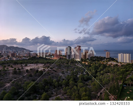 golden hour bathing peaceful coastal city, sunlit shoreline during tranquil golden evening hours golden hour bathing peaceful coastal city, sunlit shoreline during tranquil golden evening hours 132420333