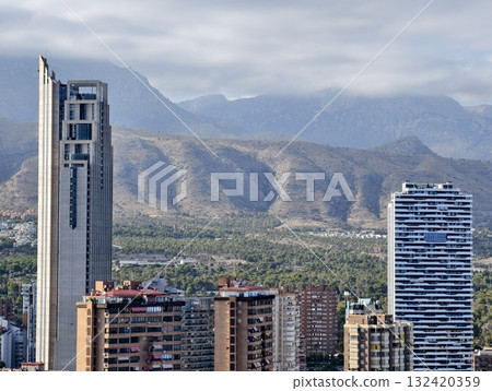 cityscape with mountains and residences, highrise skyline near mountain ranges with peaceful cityscape with mountains and residences, highrise skyline near mountain ranges with peaceful 132420359
