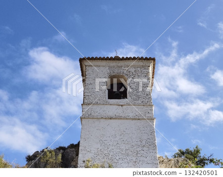 detailed view of bell and textured walls beneath expansive blue sky for editorial purposes detailed view of bell and textured walls beneath expansive blue sky for editorial purposes 132420501