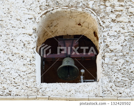 historic bronze bell in rustic niche, aged bronze bell within weathered architectural niche setting historic bronze bell in rustic niche, aged bronze bell within weathered architectural niche setting 132420502