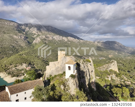 aerial snapshot of vibrant village, scenic drone shot of colorful village next to turquoise water 132420508