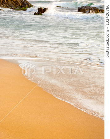nature with sea foam at the beach. background with wave on the sand. summer vacation at the seaside 132420766