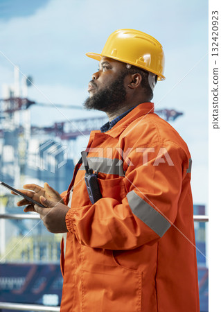 Environmental expert inspects offshore platform operations for pollution control compliance. Drilling barge engineer evaluates waste management systems to reduce ocean contamination 132420923