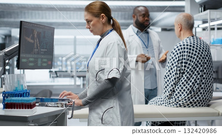 Woman expert examining chemical reaction to patient vitals in clinical procedure, testing new drug and studying treatment outcomes. Research for healthcare and toxicology innovation. Camera B. Woman expert examining chemical reaction to patient vitals in clinical procedure, testing new drug and studying treatment outcomes. Research for healthcare and toxicology innovation. Camera B. 132420986