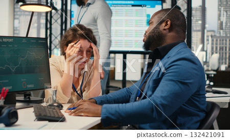 Woman team leader being exasperated due to work pressure and chaos, struggling to save the business image. Worried displeased boss feels disappointed with her staff, job tension. Camera B. 132421091