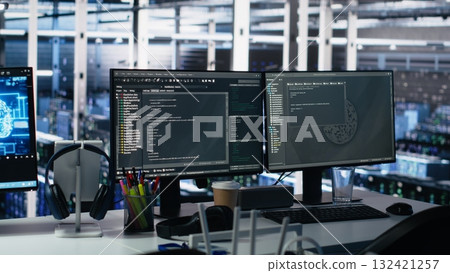 Server room PC screens tracking mainframes processing large scale machine learning datasets for artificial intelligence operations. Computer displays monitoring gear used in AI model development 132421257