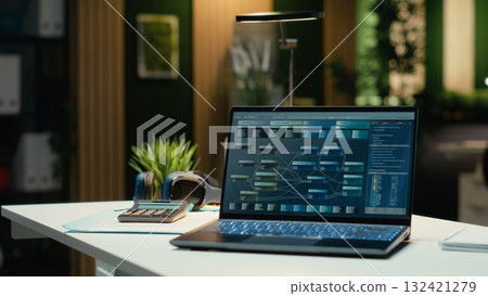 Luxurious modern office space with important reports on laptop, empty desk showcasing important data analytics and insight for management and business administration tasks. Forecasting. Luxurious modern office space with important reports on laptop, empty desk showcasing important data analytics and insight for management and business administration tasks. Forecasting. 132421279