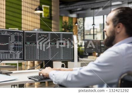 Portfolio manager uses stock exchange app on PC to review assets performance and adjusts holdings. Forex trading business employee oversees investment portfolios on computer to maximize returns Portfolio manager uses stock exchange app on PC to review assets performance and adjusts holdings. Forex trading business employee oversees investment portfolios on computer to maximize returns 132421292
