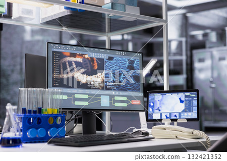 PC in lab with software interface showing genetic markers associated with disease risk. Computer in laboratory used to study DNA strand mapping with genomics analysis program 132421352