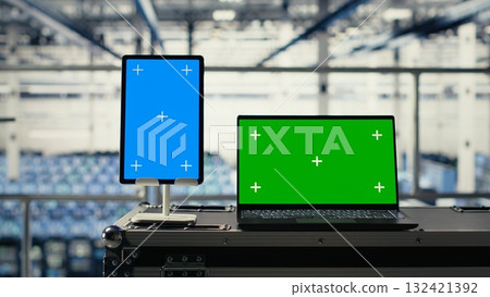 Green screen notebook and mockup tablet in industrial data center using artificial intelligence technology. Deep learning tech on isolated screen device and chroma key laptop in server room 132421392