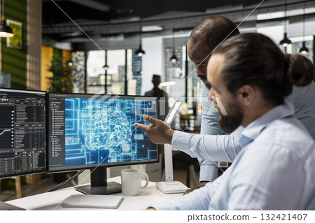 Team of stockbrokers running AI technology on PC to do automated trading and portfolio rebalancing. Prop firm coworkers applying machine learning algorithms to analyze complex market data 132421407