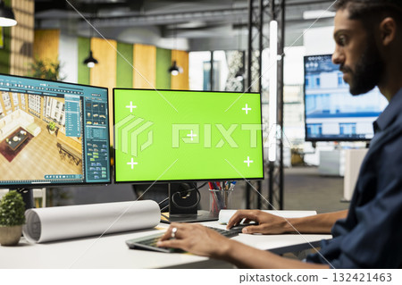Middle eastern contractor prepares apartment floor plan next to copy space monitor, decorating and designing the new construction building layout. 3D software for interior design. Middle eastern contractor prepares apartment floor plan next to copy space monitor, decorating and designing the new construction building layout. 3D software for interior design. 132421463