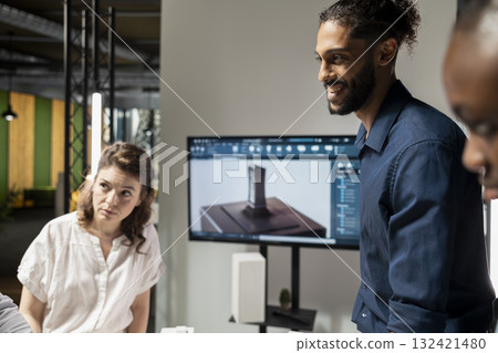 Property development team evaluating 3D models structural layout for a housing project focused on sustainability and urban infrastructure growth. Modern briefing meeting for site construction. 132421480