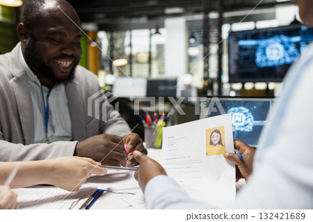Diverse recruiters using deep learning pc software for profile evaluation, filtering through applicants CV data and helping HR team with decision making. Filling in the company job opening. Diverse recruiters using deep learning pc software for profile evaluation, filtering through applicants CV data and helping HR team with decision making. Filling in the company job opening. 132421689