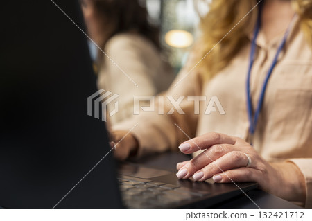 Close up of woman boss analyzing charts and performance indicators on laptop, working on analysis in a modern corporate boardroom for commitment to organizational development. Progress. 132421712
