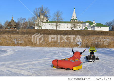 Winter activities, snowmobile with an inflatable bull Winter activities, snowmobile with an inflatable bull 132421763