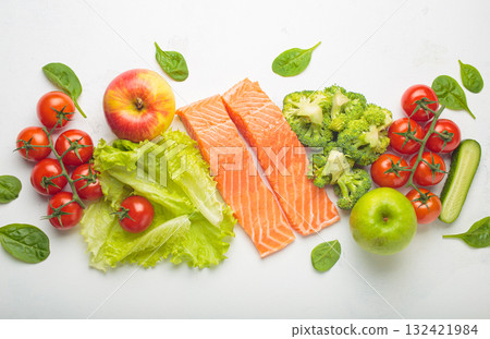 Fresh raw healthy food vegetables fruit salmon fillet white background, inflammatory diet, clean eating Fresh raw healthy food vegetables fruit salmon fillet white background, inflammatory diet, clean eating 132421984