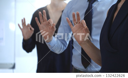 Business professionals showing ok hand gestures during a seminar, symbolizing agreement, teamwork, success, and positive communication in a corporate meeting setting Business professionals showing ok hand gestures during a seminar, symbolizing agreement, teamwork, success, and positive communication in a corporate meeting setting 132422626