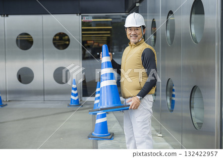 Security guards directing people through the event space 132422957