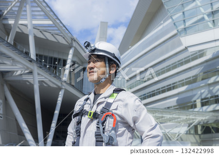 Worker wearing a full harness Worker wearing a full harness 132422998