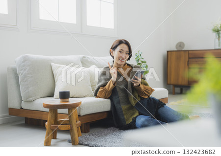 Woman holding a smartphone Woman holding a smartphone 132423682