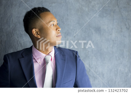 A foreign man wearing a suit and thinking A foreign man wearing a suit and thinking 132423702