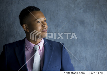 A foreign man wearing a suit and thinking 132423703