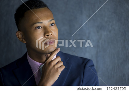 A foreign man wearing a suit and thinking A foreign man wearing a suit and thinking 132423705