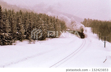 D51 train traveling through a heavy snow area, 1970, Hakodate Main Line, Ginzan-Shikaribetsu, Hokkaido, archival photograph 132423853