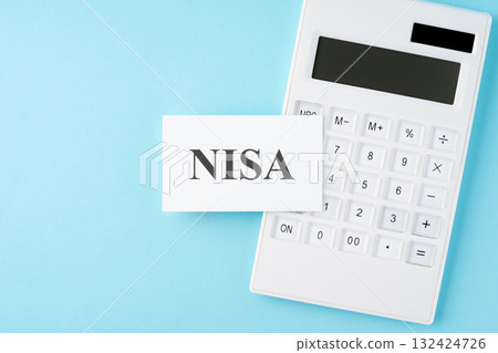 NISA lettering and calculator on a light blue background NISA lettering and calculator on a light blue background 132424726