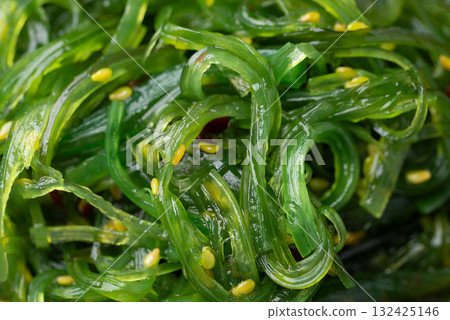 Wakame seaweed salad with sesame seed texture background, Top view 132425146