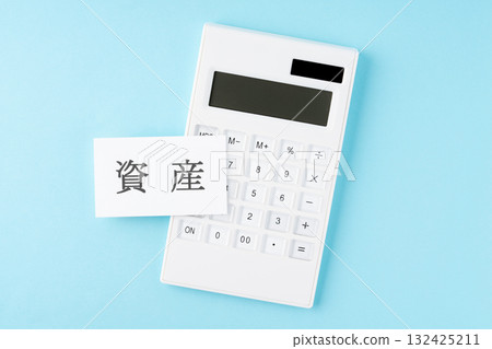 Assets word and calculator on light blue background Assets word and calculator on light blue background 132425211