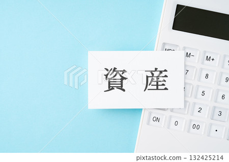 Assets word and calculator on light blue background 132425214