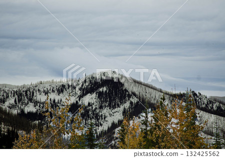 Snow Covered Mountain Ridge in Cloudy Sky Idaho 132425562