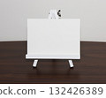 Easel and white card 132426389