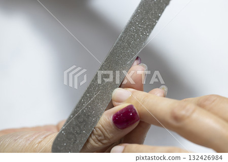 A woman getting her nails done A woman getting her nails done 132426984
