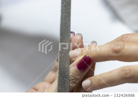 A woman getting her nails done A woman getting her nails done 132426986