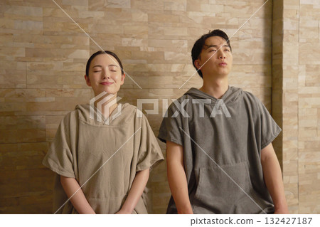 Young couple using the sauna Young couple using the sauna 132427187
