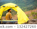 Lifestyle man travel hiker adventure and tent camping on mountain nature landscape. 132427260
