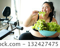 Asian woman eating healthy food salad before fitness exercise for lose weight. 132427475