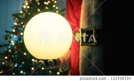 santa claus holding a magical ball santa claus holding a magical ball 132430134