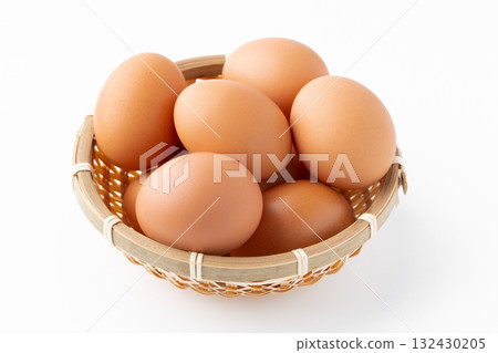 Chicken eggs (akadama) in a bamboo basket on a white background Chicken eggs (akadama) in a bamboo basket on a white background 132430205