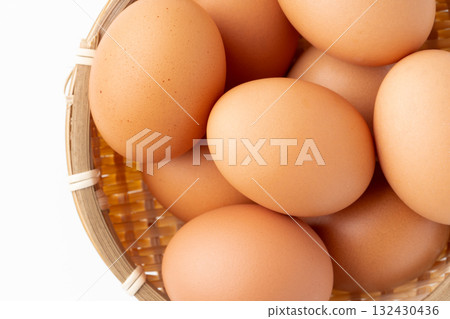 Close-up of chicken eggs (akadama) in a bamboo basket 132430436