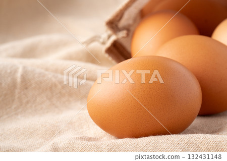 Close-up of a chicken egg (akadama) placed on a cloth 132431148