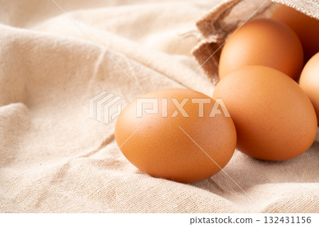 Close-up of a chicken egg (akadama) placed on a cloth 132431156