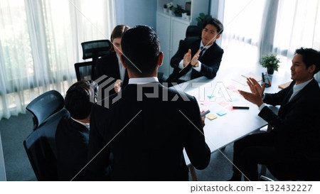 Top view of team present project and turn around to clap hands. Directorate. 132432227